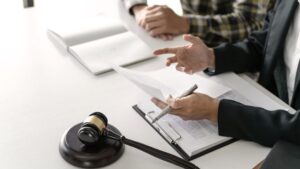 two persons working on files