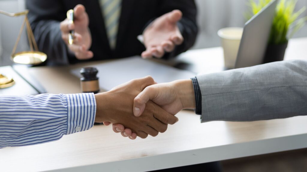 The Role of Mediation two persons shaking hands with each otherin Family Law Disputes