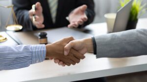 The Role of Mediation two persons shaking hands with each otherin Family Law Disputes