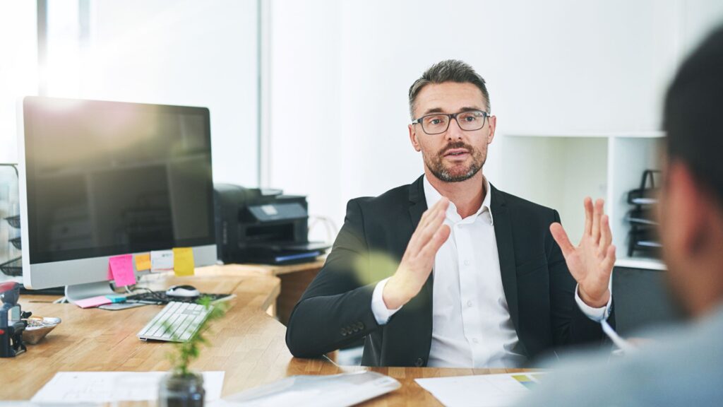 person explaining about file to another person